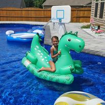 bella on a dinosaur float